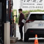 motorist stands at the fuel pump 1 6723615 1705084884936