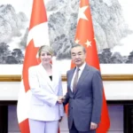 melanie joly wang yi chine visite